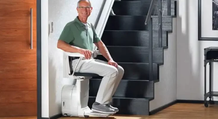 man-in-stannah-stairlift-solus-566x377